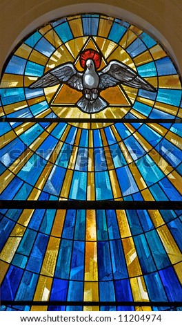 Stained Glass Window In A Medieval Church Showing The Dove Representing ...