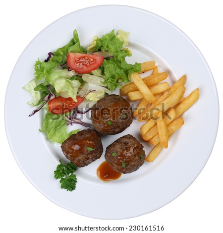 Meatballs meal with french fries and lettuce on plate isolated on a white background