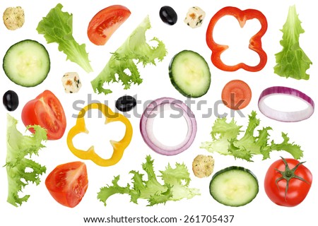 Ingredients for flying salad with tomatoes, Feta cheese, lettuce, onion, olives and cucumber