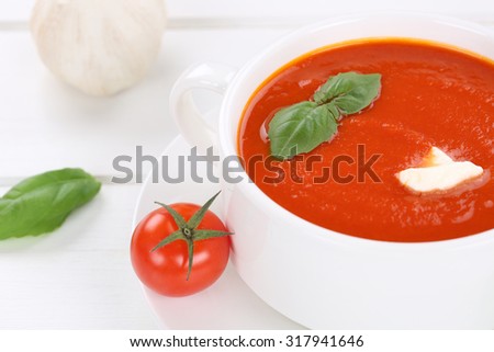 Fresh tomato cream soup meal with fresh tomatoes in bowl