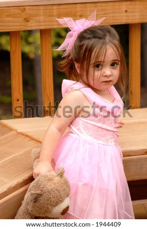 Come On Teddy - A little girl holding her favorite teddy bear playing outdoors dressed in a princess dress all in pink