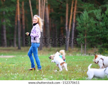 woman in motion during a walk with the dogs