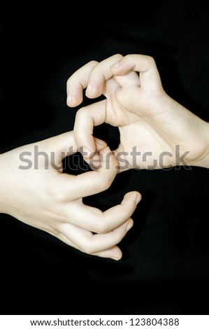 Child hands with connected fingers in a form of chain