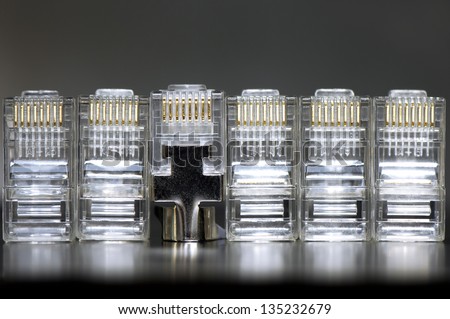 Ethernet network RJ45 heads in row with one metal shielded CAT6 head, singularity concept