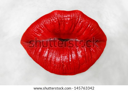 Red lips with kissing gesture