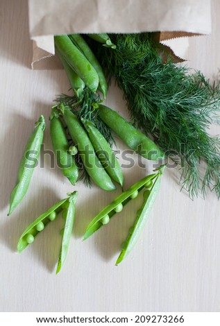 young fresh juicy pods of green peas and fennel