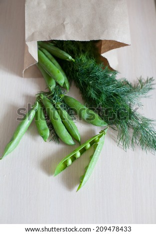 young fresh juicy pods of green peas and fennel