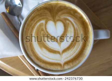 A Hot Latte Coffee art in white cup