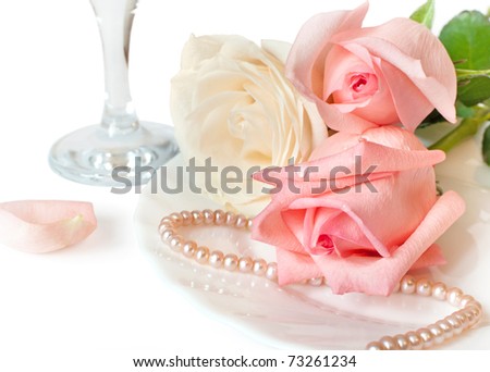 A romantic dinner with beautiful roses on a white