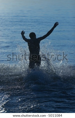 happy man run in water