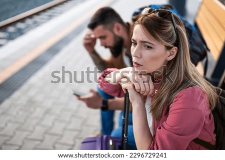Similar – Image, Stock Photo Pensive woman traveler sitting near calm lake
