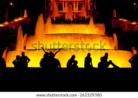 Tourist enjoy their time in front of the fountain in Barcelona