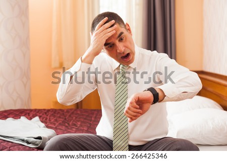 Businessman realizing that he is going to be late