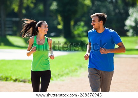 Happy couple jogging