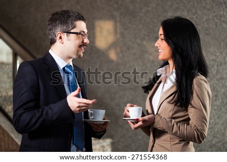Two business people talking