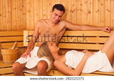 Young couple enjoying in sauna