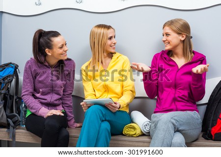 Young women in locker room before fitness training