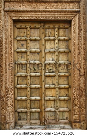 Wooden door with ancient floral patten. Wood carving technic