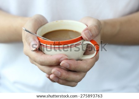 two hand hold warm coffee cup
