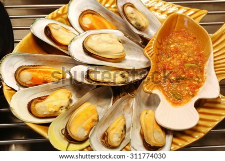 shelled mussel roasted with spicy sauce , Thai food