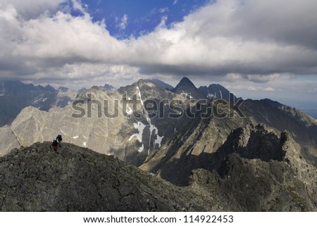 Two scramblers on the top of mountain. High Tatra Mountains.