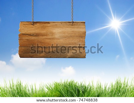 Hanging wooden sign with sun beam
