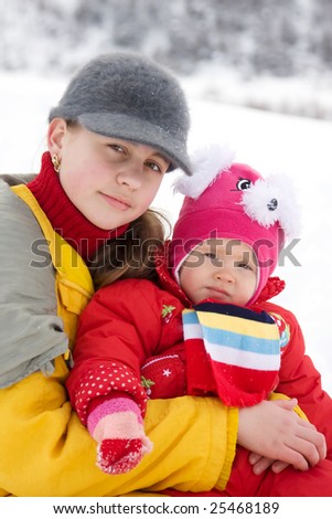 Sisters having fun in the snow
