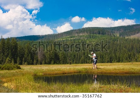 Biologist researching insects in a bog in Romania.