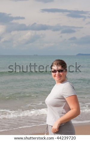 Young woman enjoying the beach at the Ionian sea in Greece