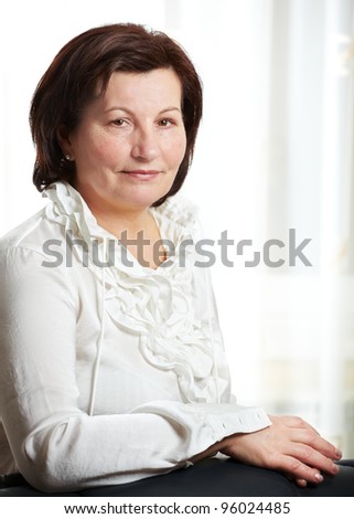 50 year old beautiful business woman portrait at the office.