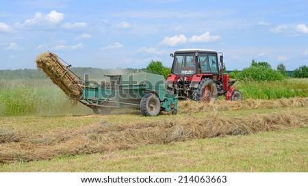 Kalush, Ukraine - June 25: Hay harvesting in the field near the town Kalush, Western Ukraine June 25, 2014