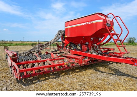 Kalush, Ukraine â?? August 10: Tractor-drawn seeding machine in position for sowing in the field near the town Kalush, Western Ukraine August 10, 2014