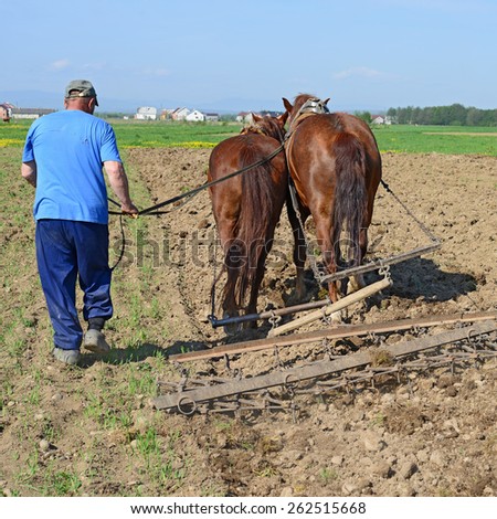 Kalush, Ukraine - April 18:Fallowing of a spring field by a manual plow on horse-drawn in the field near the town Kalush, Western Ukraine April 18, 2014