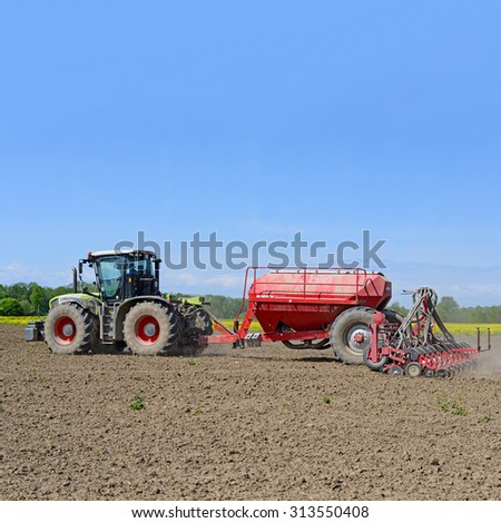 Kalush, Ukraine - May 10: Load fertilizer into the hopper for sowing maize crop in the field near the town Kalush, Western Ukraine May 10, 2015