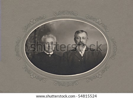 A vintage portrait photograph of an elderly couple