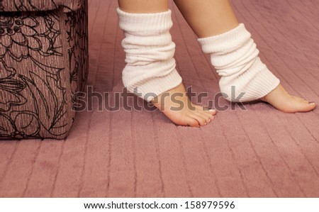 Woman wearing white leg warmers