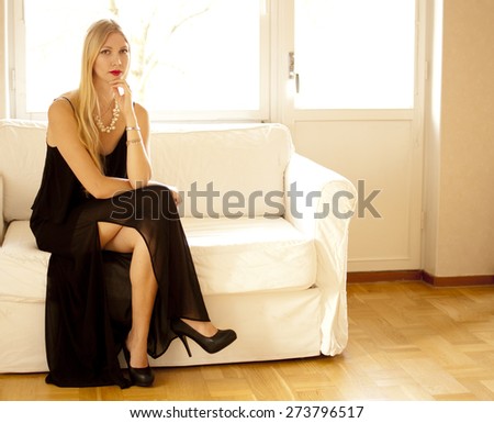 Beautiful woman sitting on couch