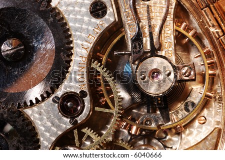 Macro view of the inside of an antique pocket watch.
