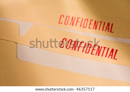 Manila folder with confidential stamps in red.