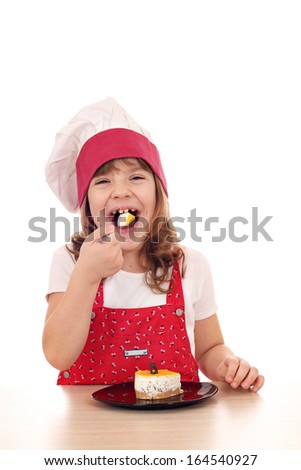 hungry little cook girl eat cake