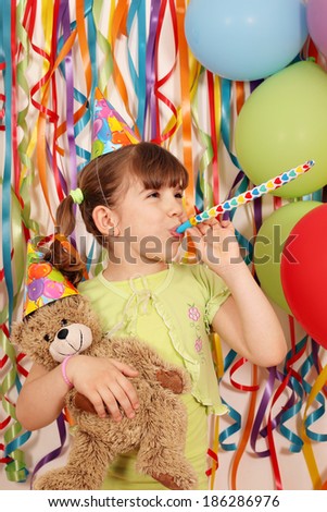 happy little girl with teddy bear birthday party