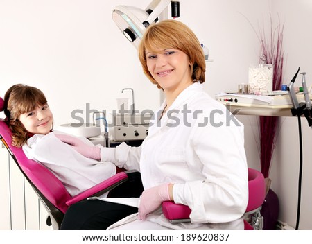 happy little girl patient and female dentist