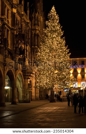 MUNICH, GERMANY - DECEMBER 25, 2009: Christmas tree at night with lights. Marienplatz square in Munich, Germany. Marienplatz is a central square in the city centre of Munich, Germany.