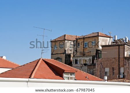 Old buildings and tiled roofs of the houses in Jerusalem.