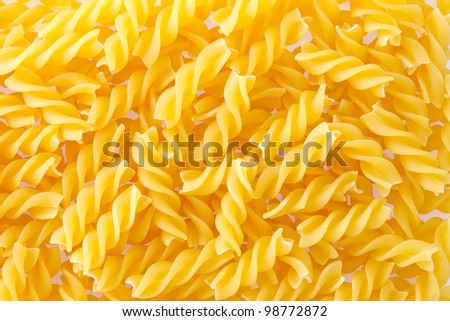 Fusilli Pasta texture background. Pasta is a staple food of traditional Italian cuisine.