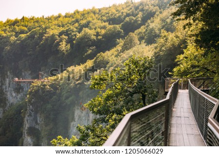 Similar – Image, Stock Photo Zeda-gordi, Georgia. View Of Paved Forest Path Leading To Canyon Okatse In Sunset Or Sunrise Time. Sun Sunshine With Natural Sunlight And Sun Rays Through Woods Trees. Beautiful Scenic View