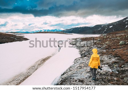 Similar – Foto Bild Aurlandsfjellet, Norwegen. Happy Young Woman Tourist Traveler Photographer With Camera Walking Near Aurlandsfjellet Scenic Route Road. Aktiver Lebensstil in der norwegischen Natur