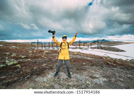 Similar – Foto Bild Aurlandsfjellet, Norwegen. Happy Young Woman Tourist Traveler Photographer With Camera Walking Near Aurlandsfjellet Scenic Route Road. Aktiver Lebensstil in der norwegischen Natur