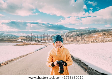 Similar – Foto Bild Aurlandsfjellet, Norwegen. Happy Young Woman Tourist Traveler Photographer With Camera Walking Near Aurlandsfjellet Scenic Route Road. Aktiver Lebensstil in der norwegischen Natur