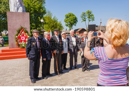 Gomel, BELARUS - MAY 9: Unidentified veterans posing at camera during the celebration of Victory Day on May 9, 2013 in Gomel, Belarus.